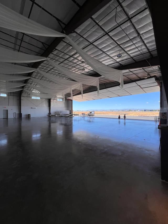 Finished hangar interior looking out through the open bay door