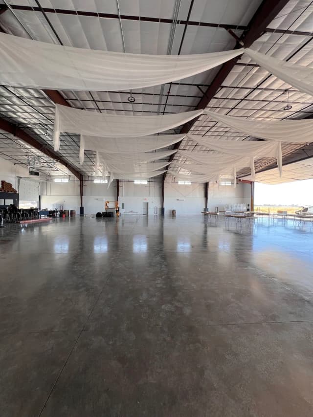 Finished Vertical Venues hangar interior with white ceiling draping